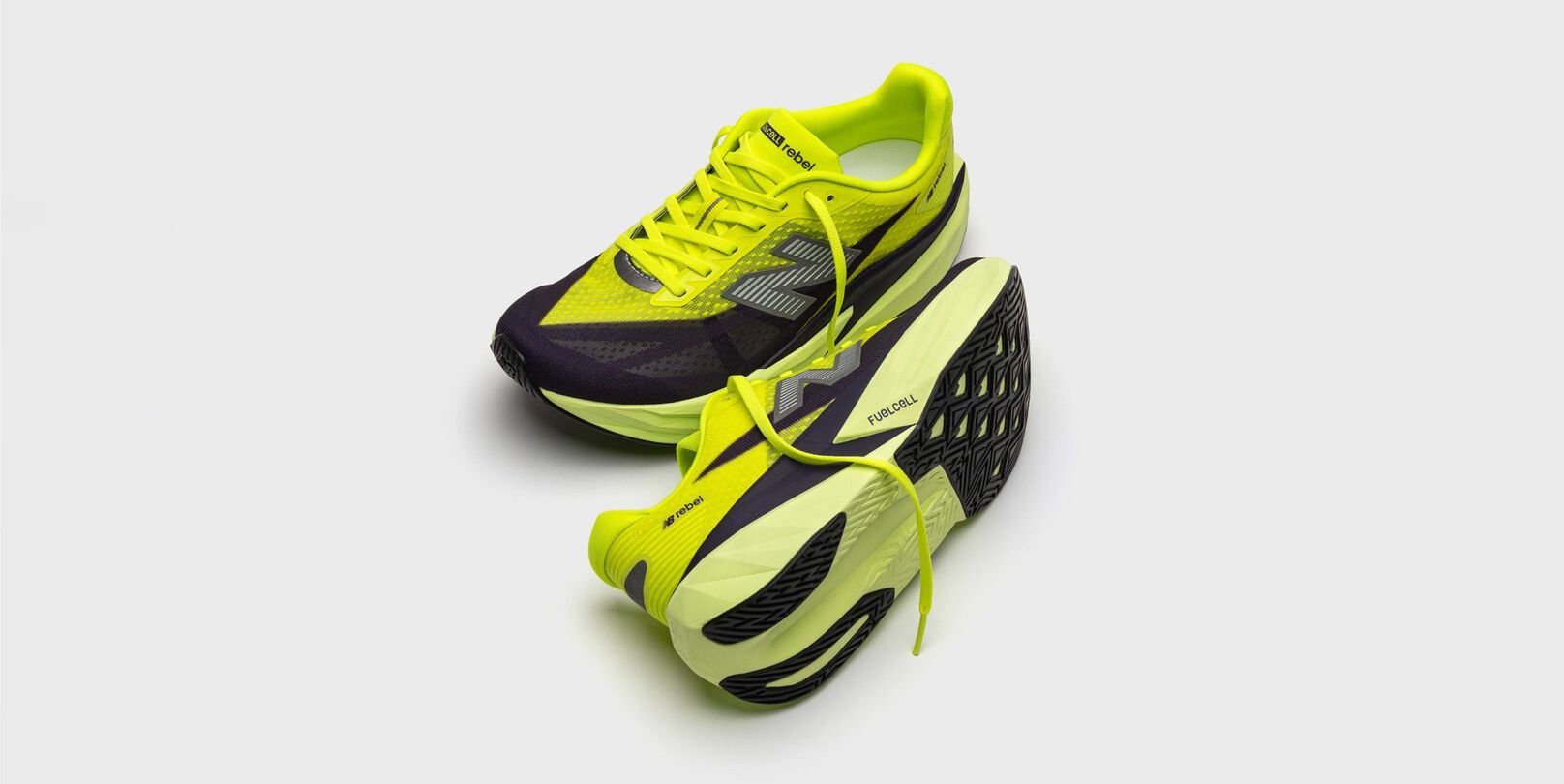 A pair of green and black FuelCell Rebel v5 shoes. 